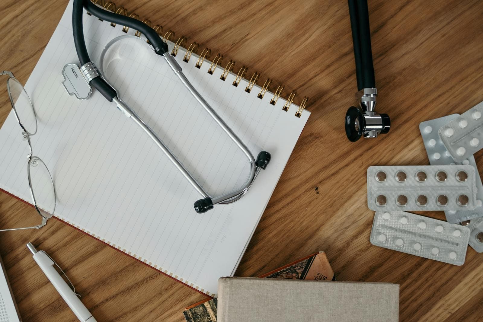 Doctor's desk — every PingMeDoc request is reviewed by a registered medical practitioner